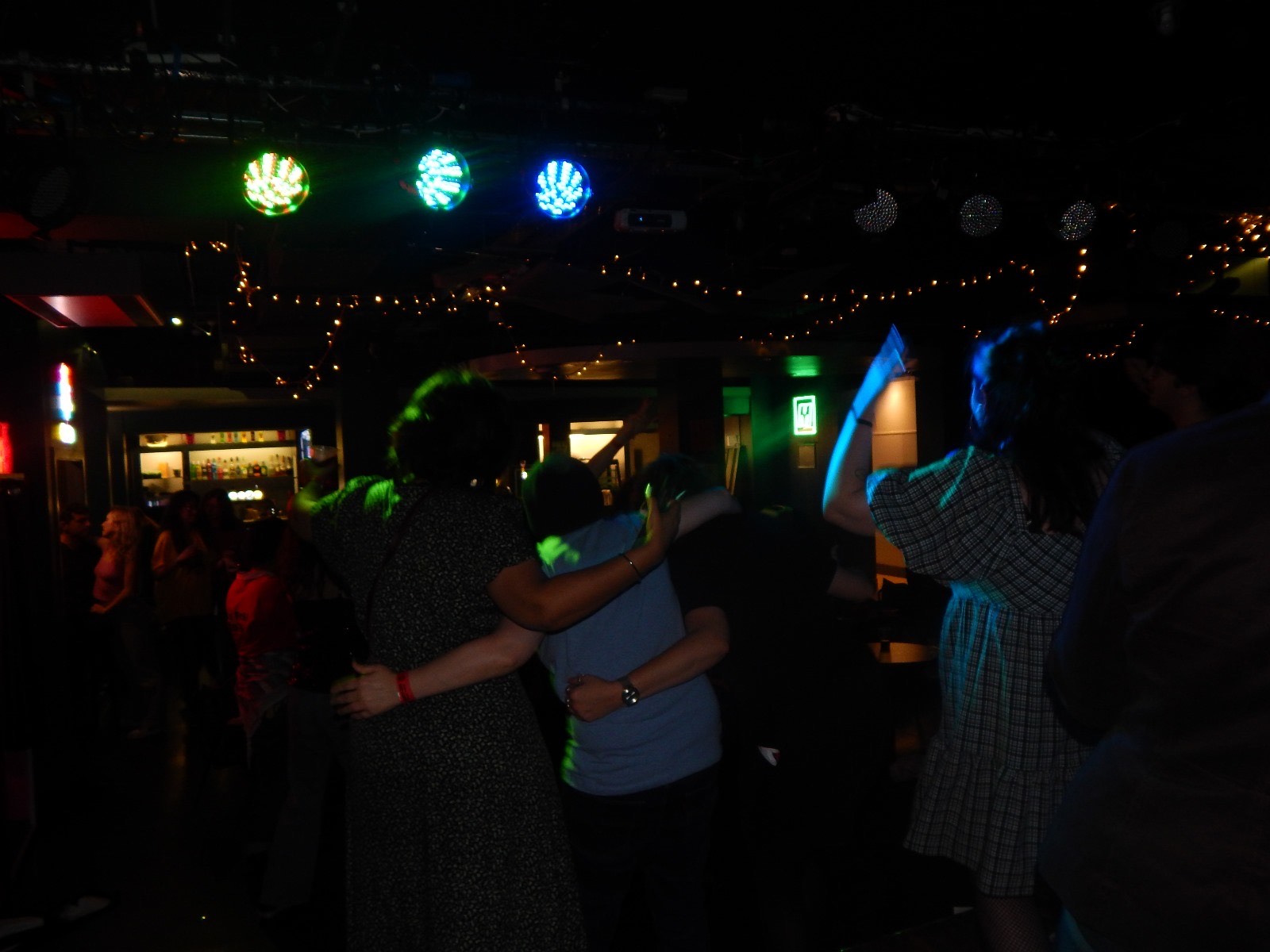 Audience members gathered in Jim's bar, QMU for LMHR gig